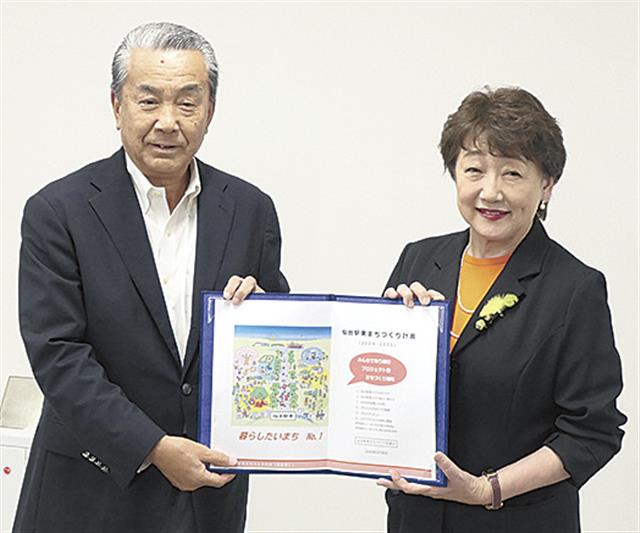 郡市長（右）と松坂理事長